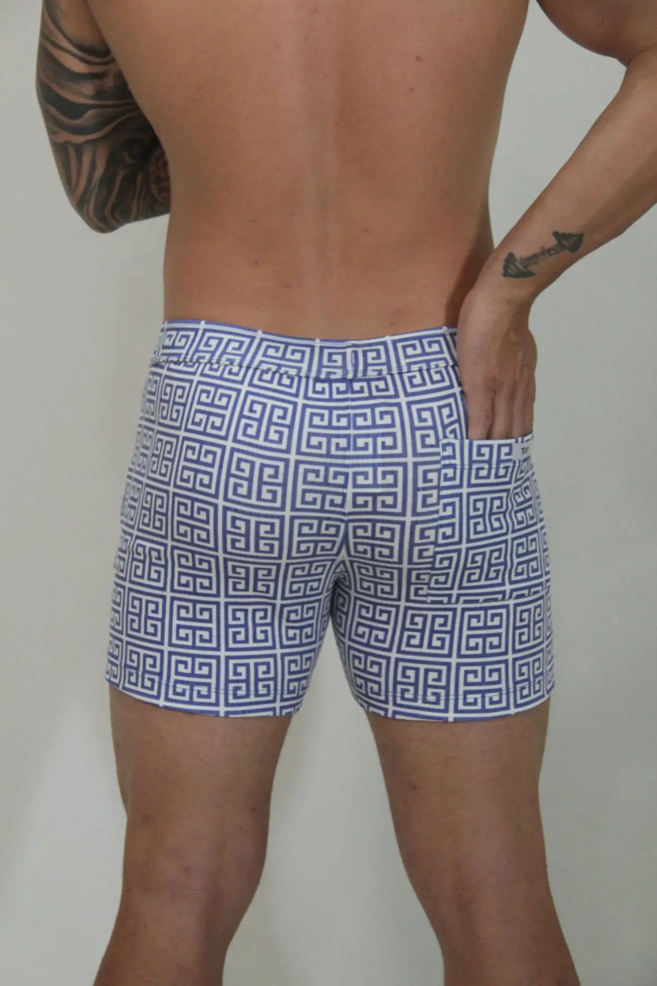 Designer print linen texture shorts in blue and white geometric pattern swim trunks for beachwear