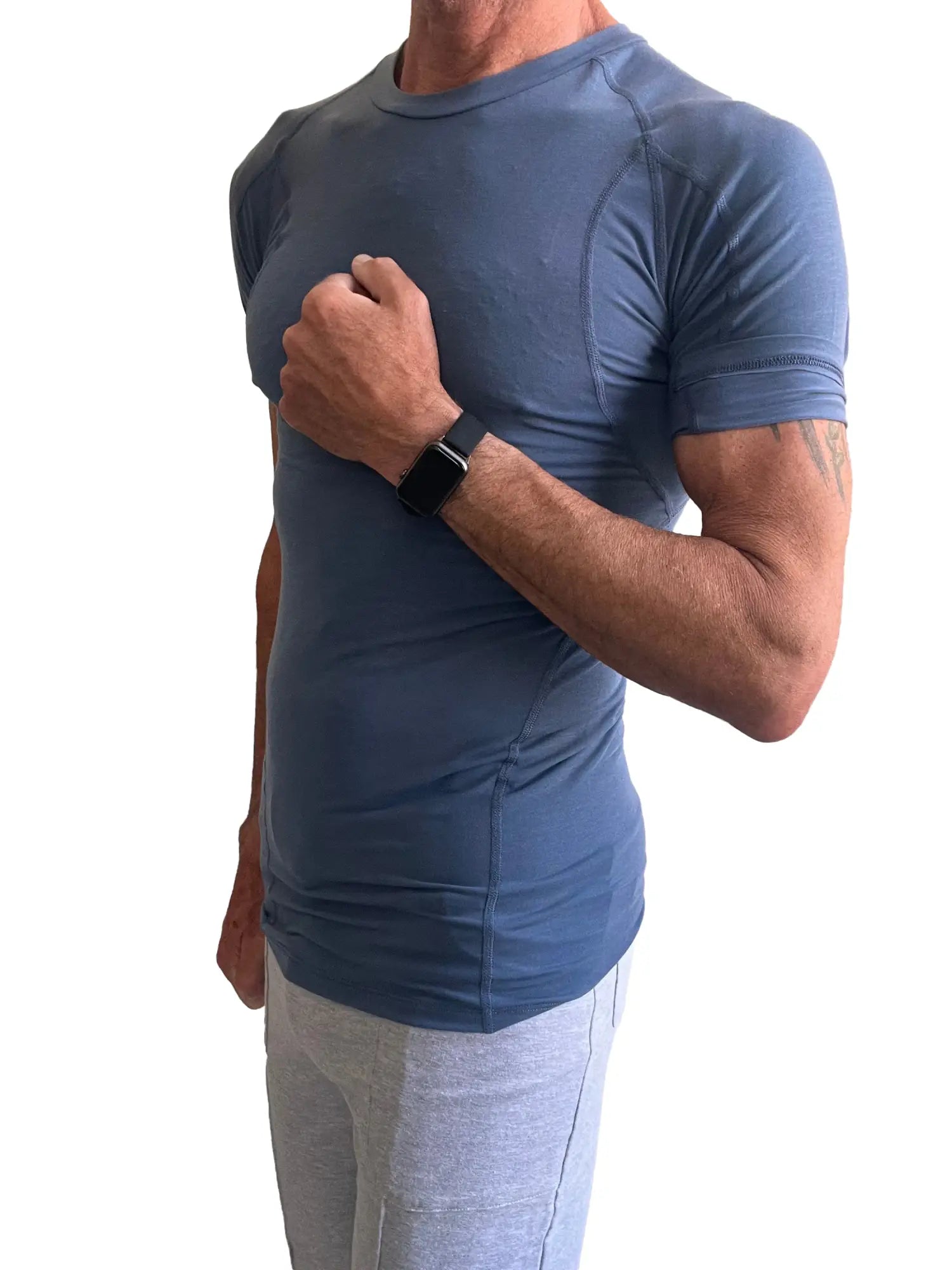 Designer raglan crew-neck tee in denim blue featuring a fitted performance-style design and short sleeves