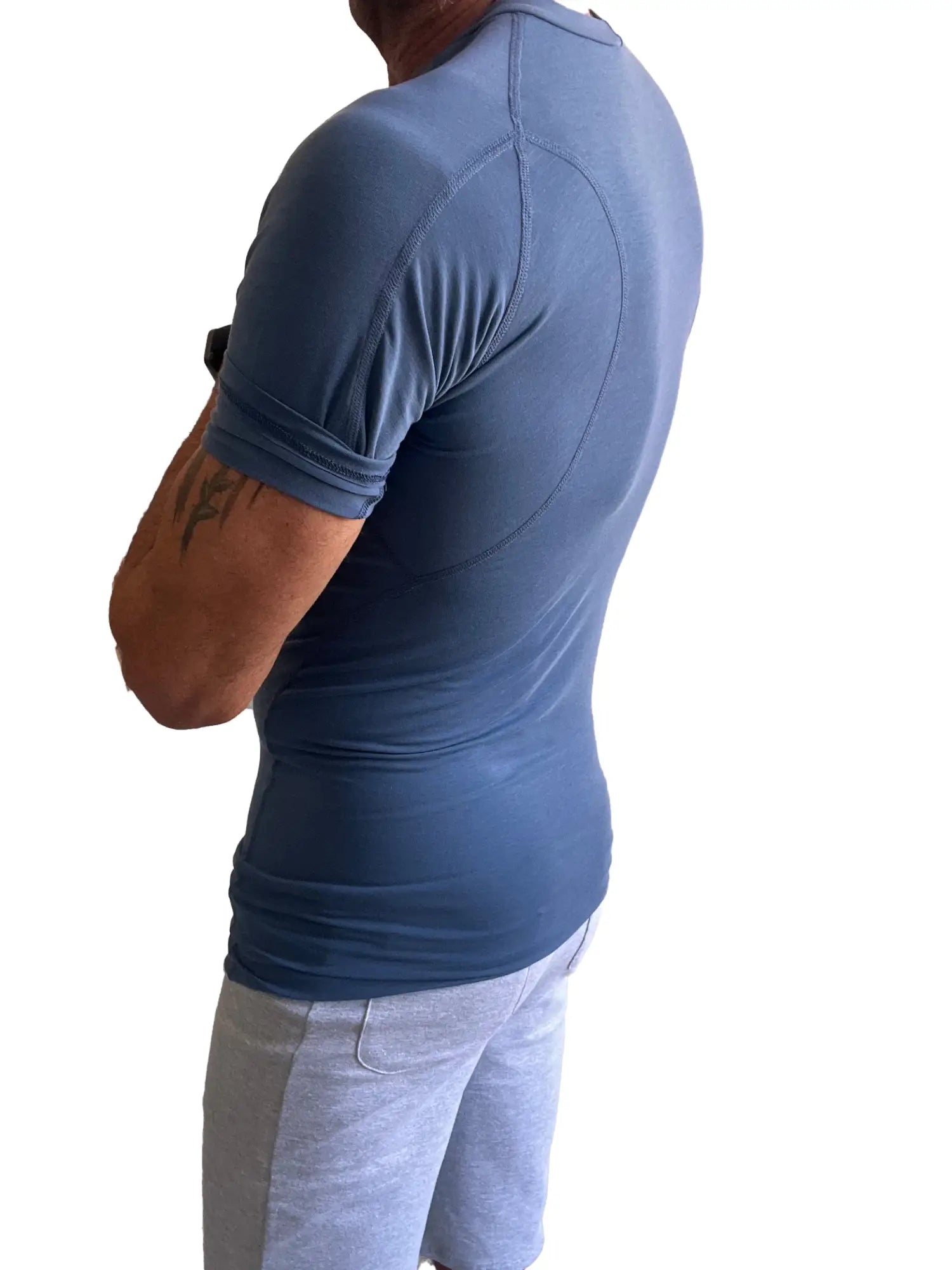 Designer raglan crew-neck tee in denim blue featuring a fitted short-sleeved athletic shirt with elasticated cuffs