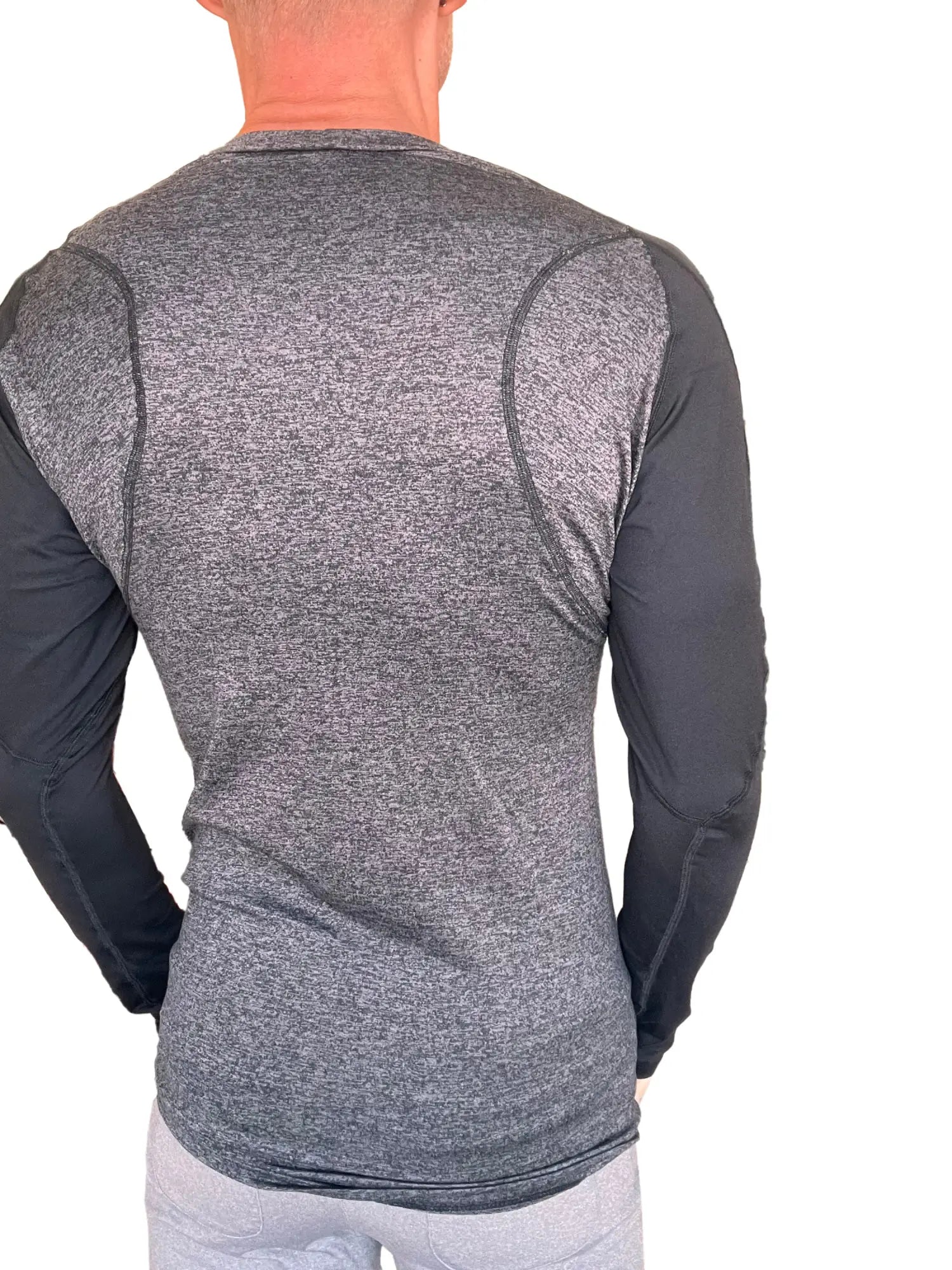Designer raglan crew neck long sleeve tee in charcoal with black sleeves featuring a heathered torso texture