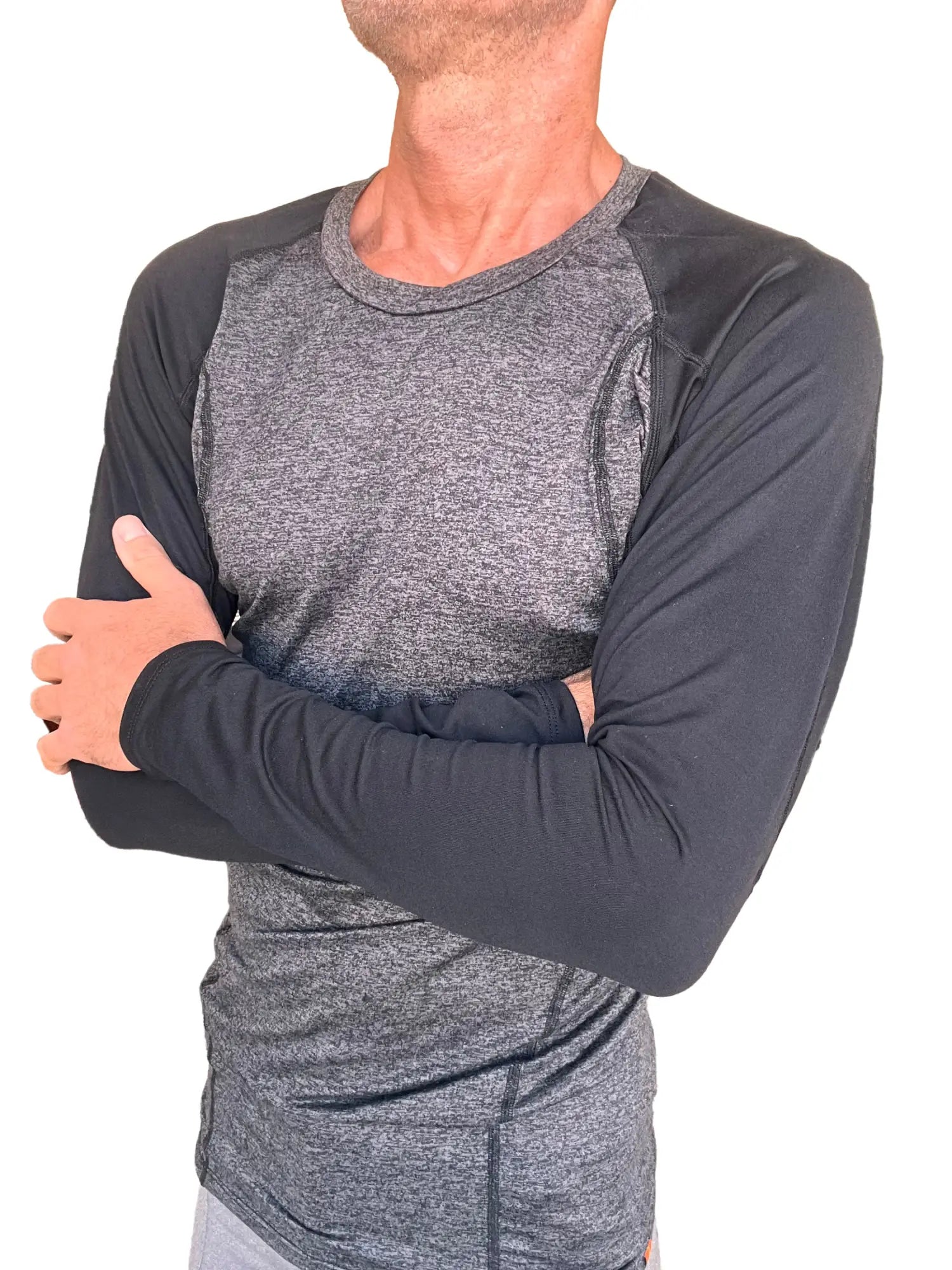A men’s long-sleeved designer raglan crew-neck tee in charcoal heather gray body with black sleeves