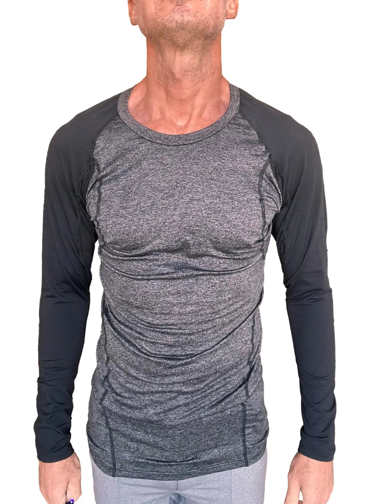 A men’s fitted long-sleeved athletic shirt in charcoal heather gray with black raglan sleeves for active wear