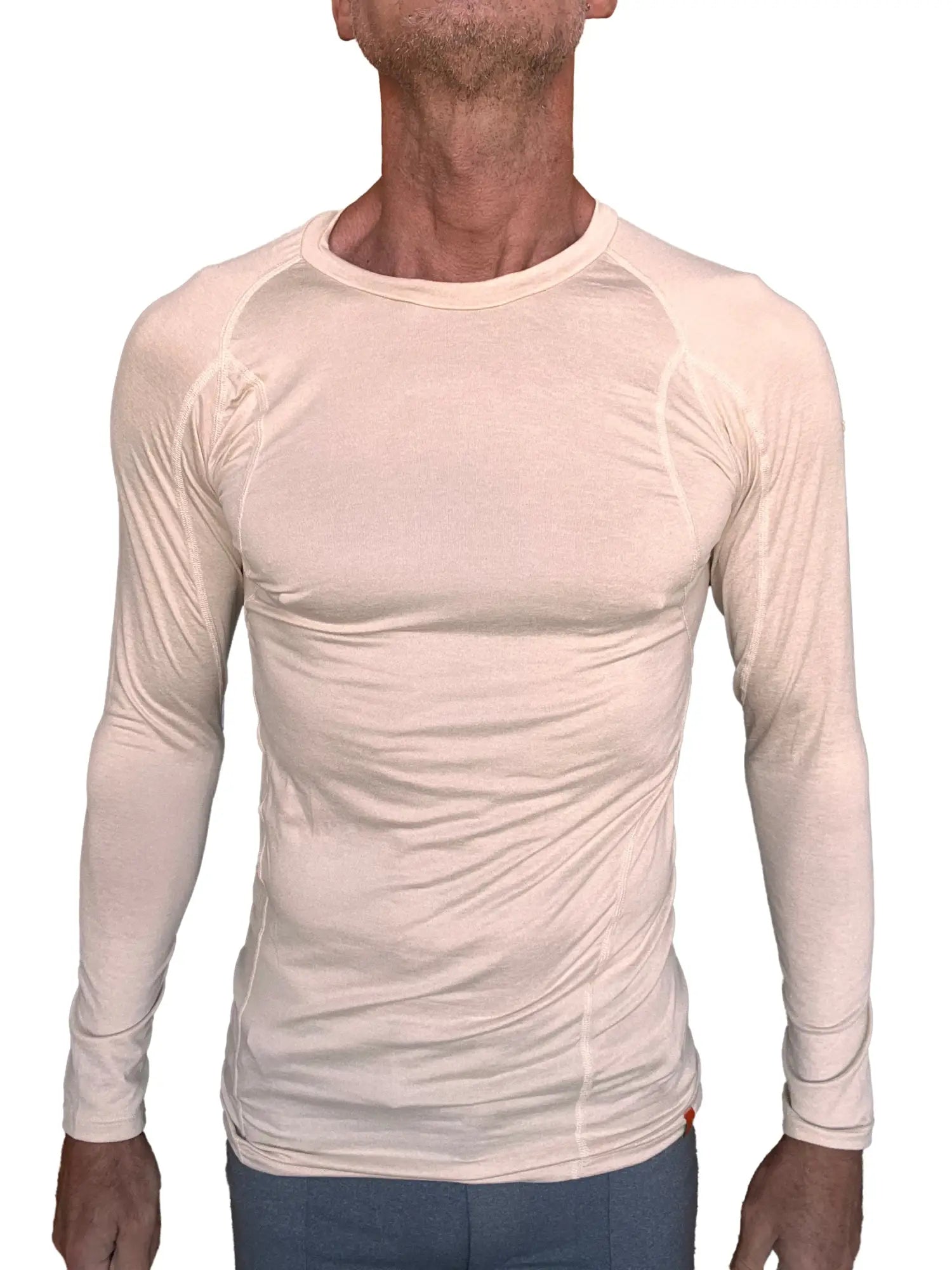 Beige long-sleeved designer raglan crew-neck performance tee with subtle seam detailing in sand beige color