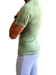 A light green fitted short-sleeved designer raglan crew-neck tee with subtle seam detailing for athletic wear