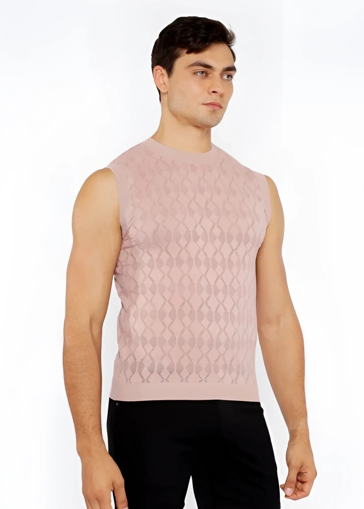 A soft pink sleeveless diamond pointelle knit vest with subtle textured pattern perfect for layering