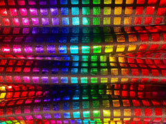 Disco queen tank featuring rainbow-colored holographic fabric with a grid of shimmering reflective squares