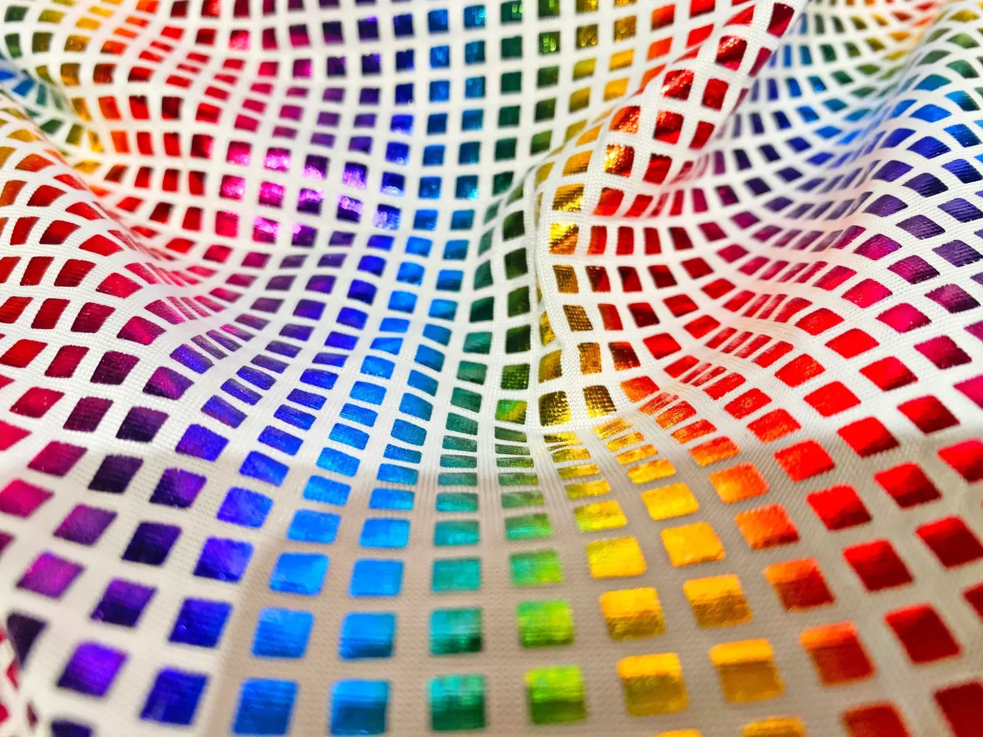 Disco queen tank featuring rainbow-colored mesh fabric with iridescent square tile grid for a vibrant look