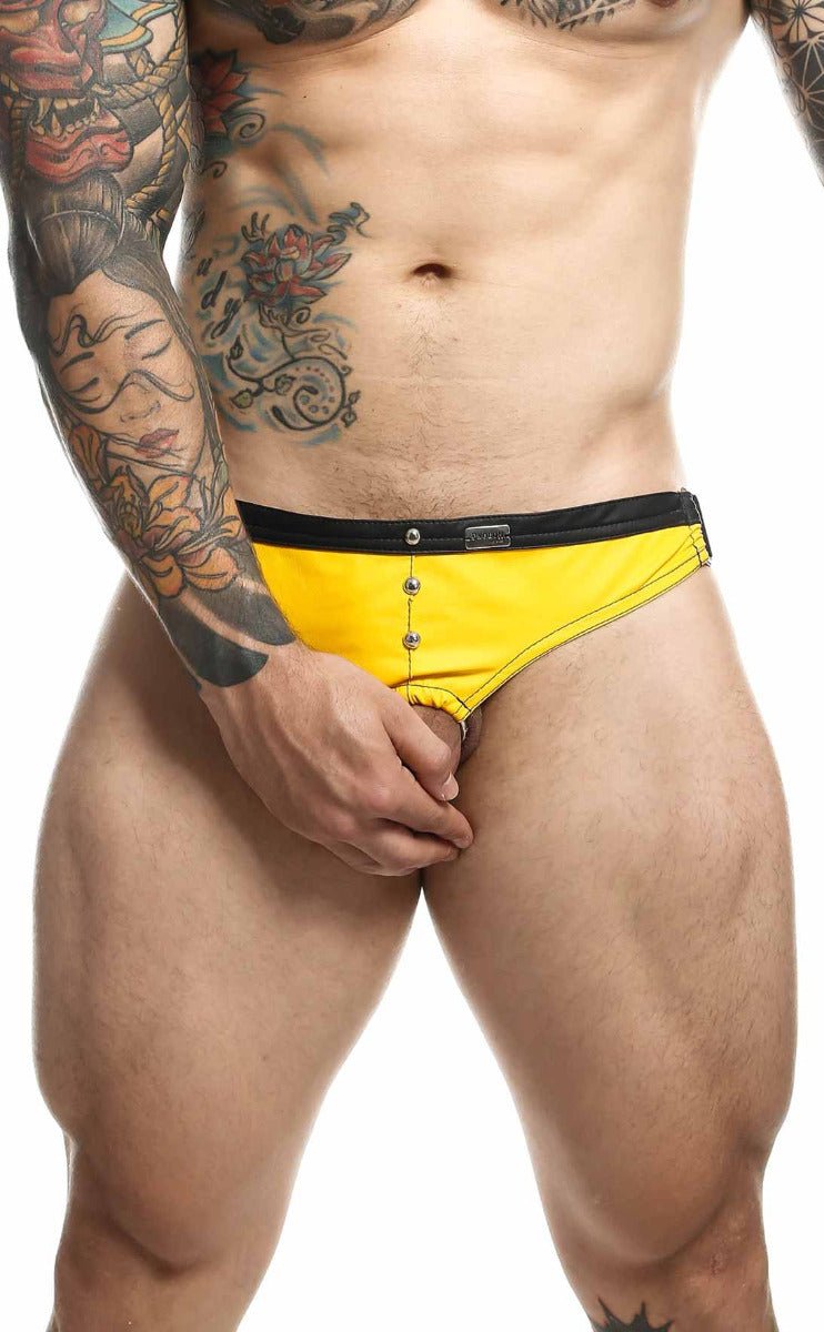 Bright yellow dngeon C-ring jockstrap swim trunks with black waistband and silver button closures in front view