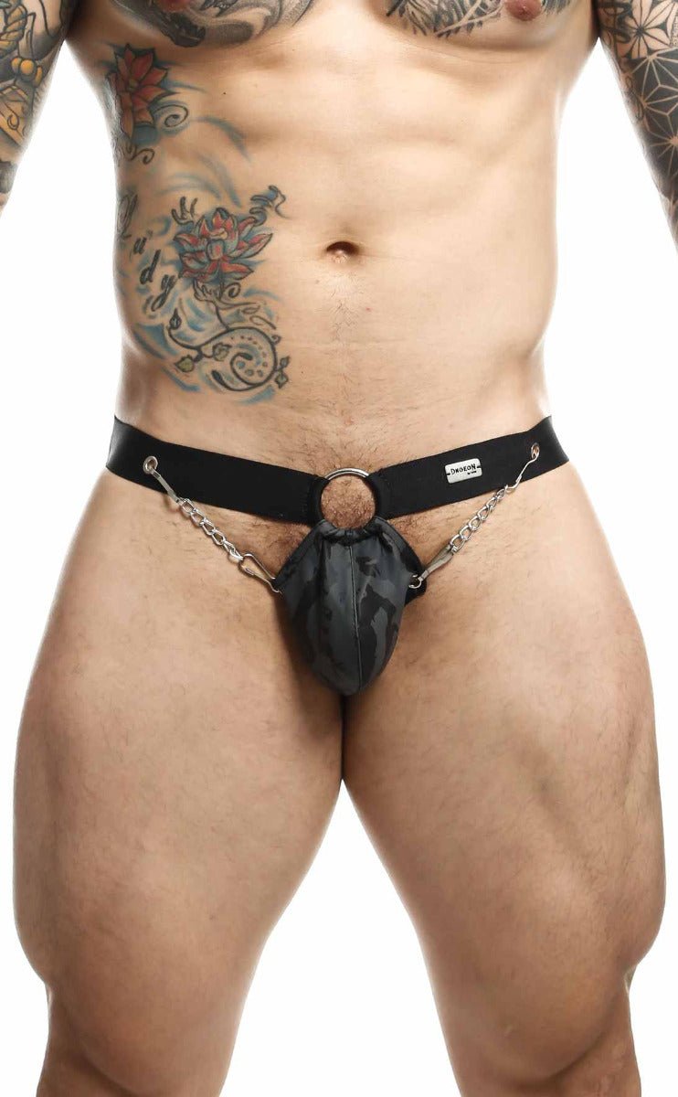 Black leather harness-style briefs with central ring and attached chains in the dngeon chain jockstrap design