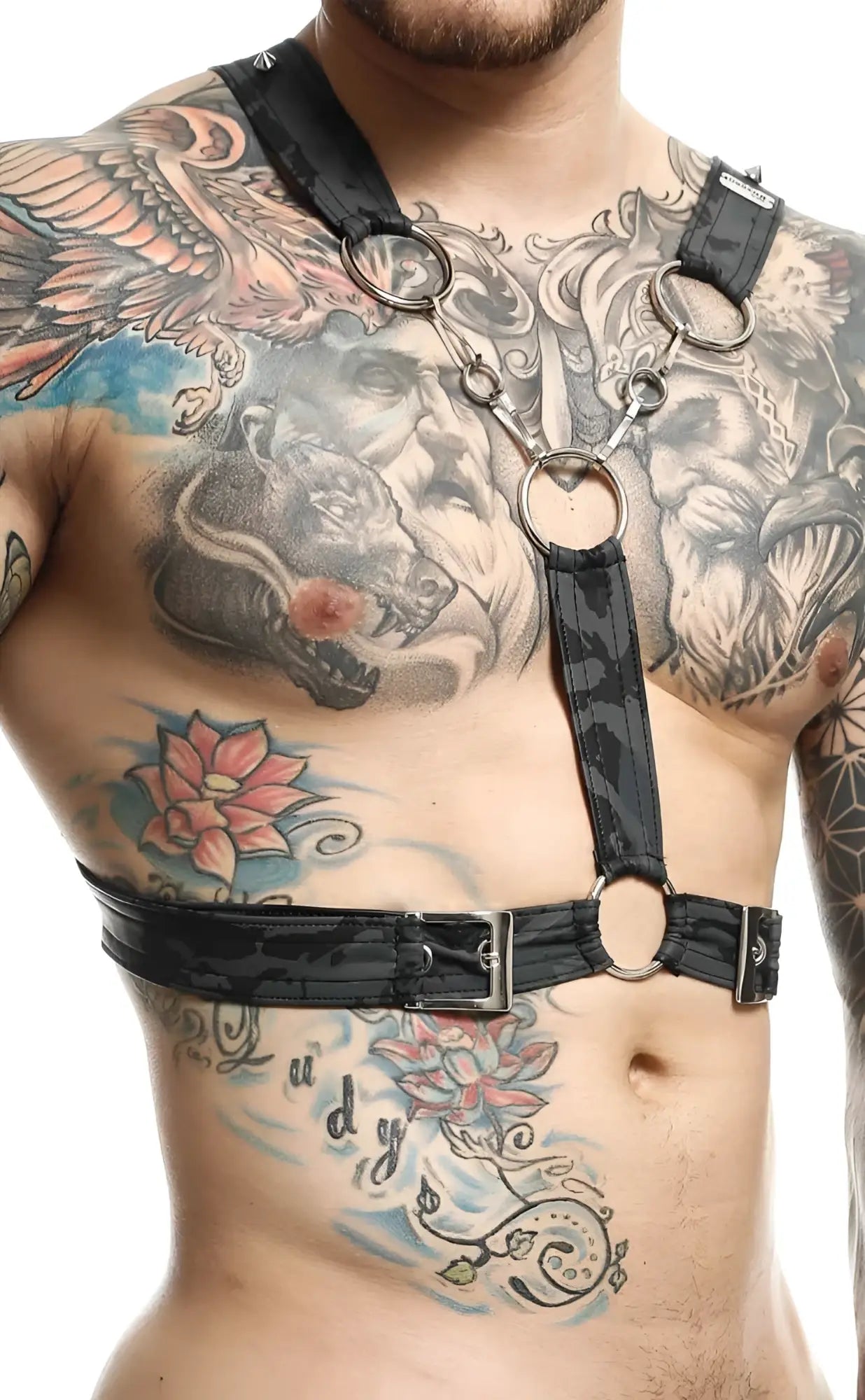 Black leather cross chain harness by DNGEON with silver metal rings and buckles for edgy fashion styling