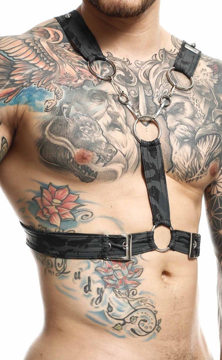 Black leather cross chain harness by DNGEON with silver metal rings and buckles for edgy fashion styling