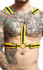 Dngeon cross chain harness featuring bright yellow and black striped leather with metal rings and buckles