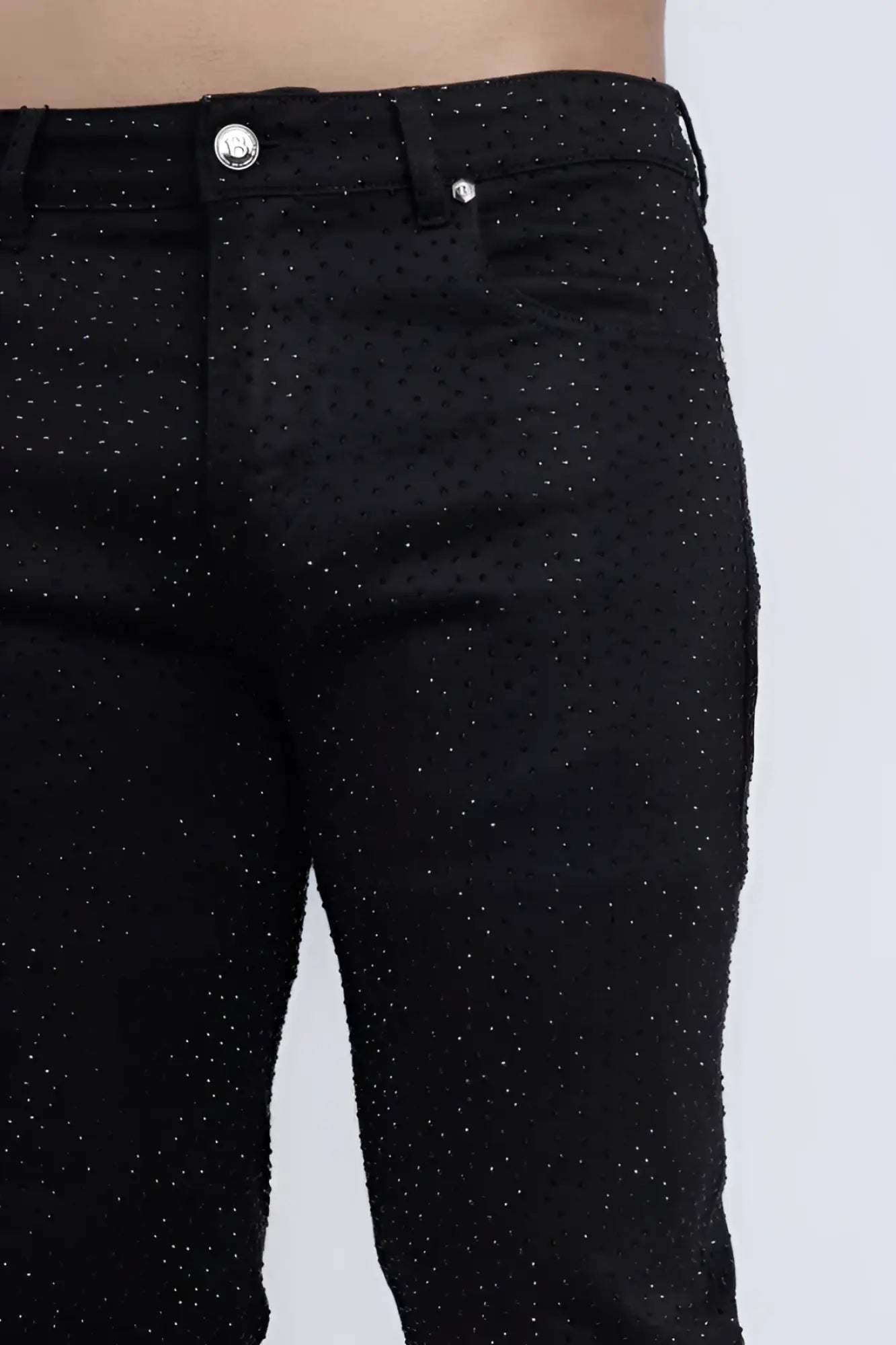 Dolorosa rhinestone jeans in black denim with a subtle glittery dot pattern and silver-toned button closure