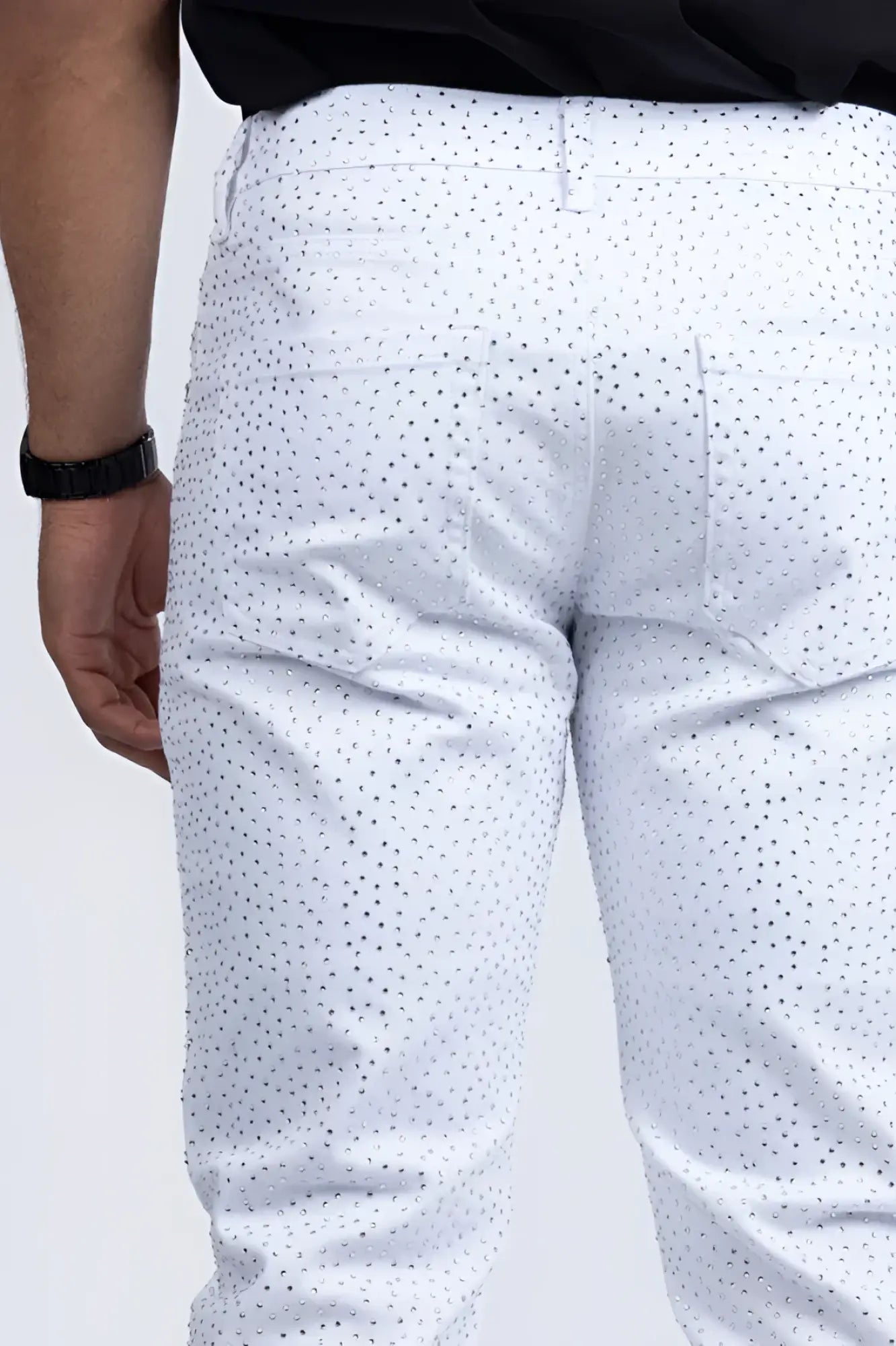 White dolorosa rhinestone jeans featuring a subtle black dot pattern on lightweight denim fabric
