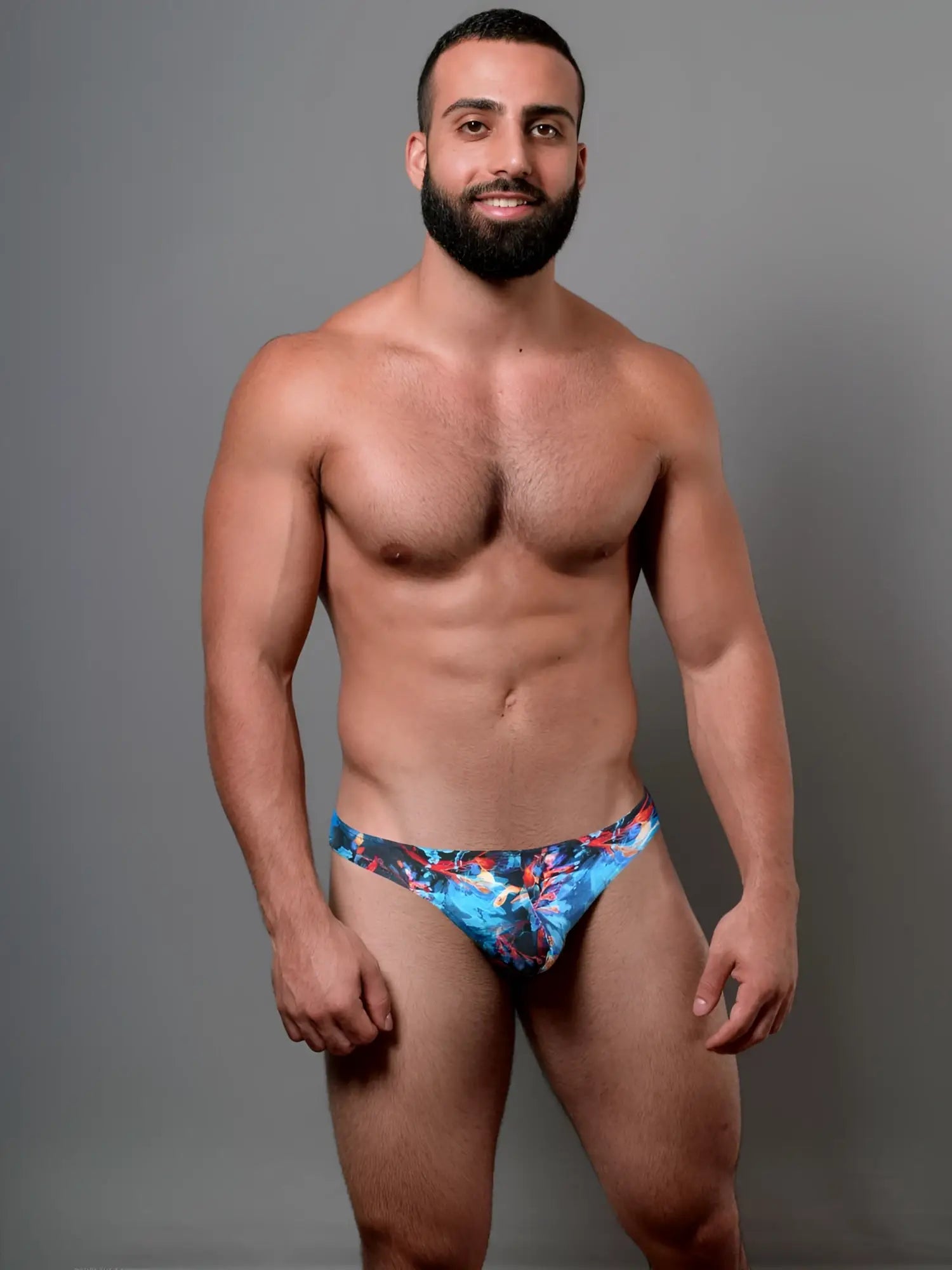 Doreanse 1341-prn deep sea thong swim trunks with blue and red floral pattern for beach and pool use