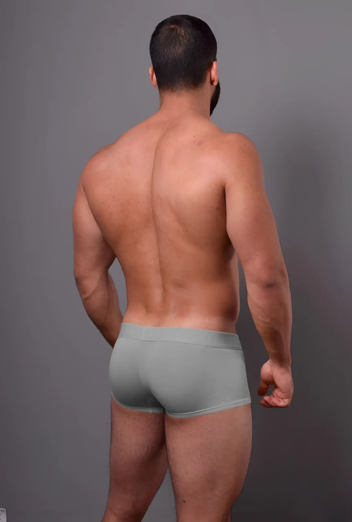 A man wearing doreanse 1760-gry low-rise light gray form-fitting briefs designed for comfort and support
