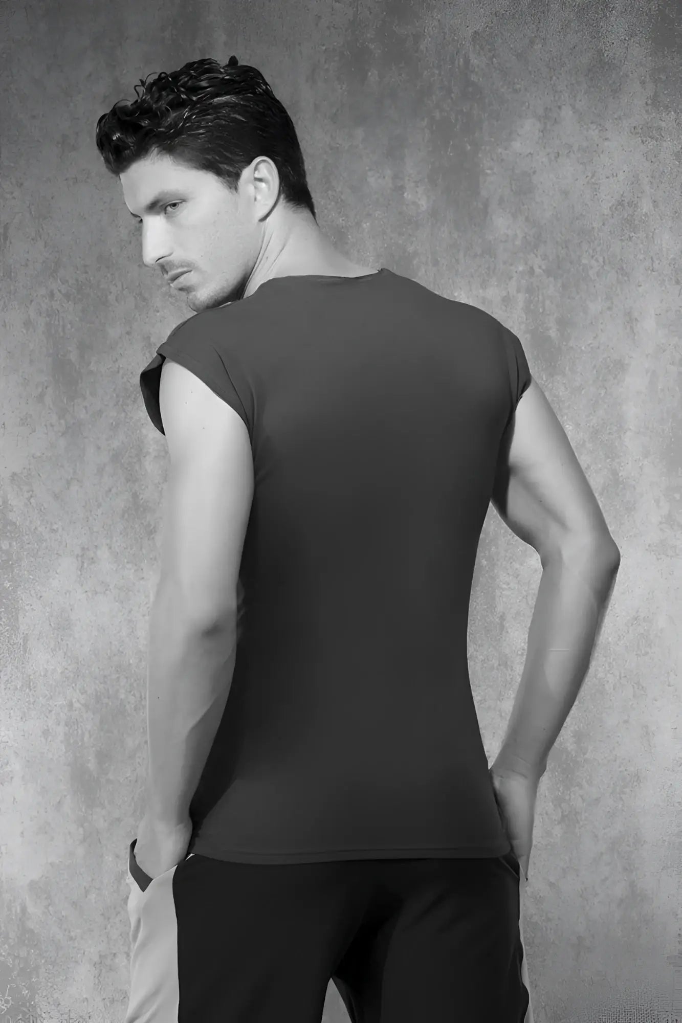 Black sleeveless fitted top with rounded neckline paired with doreanse navy short sleeved t shirt size s