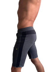 Eco-track short charcoal with black featuring dark gray athletic fabric and a black vertical stripe with elastic waistband