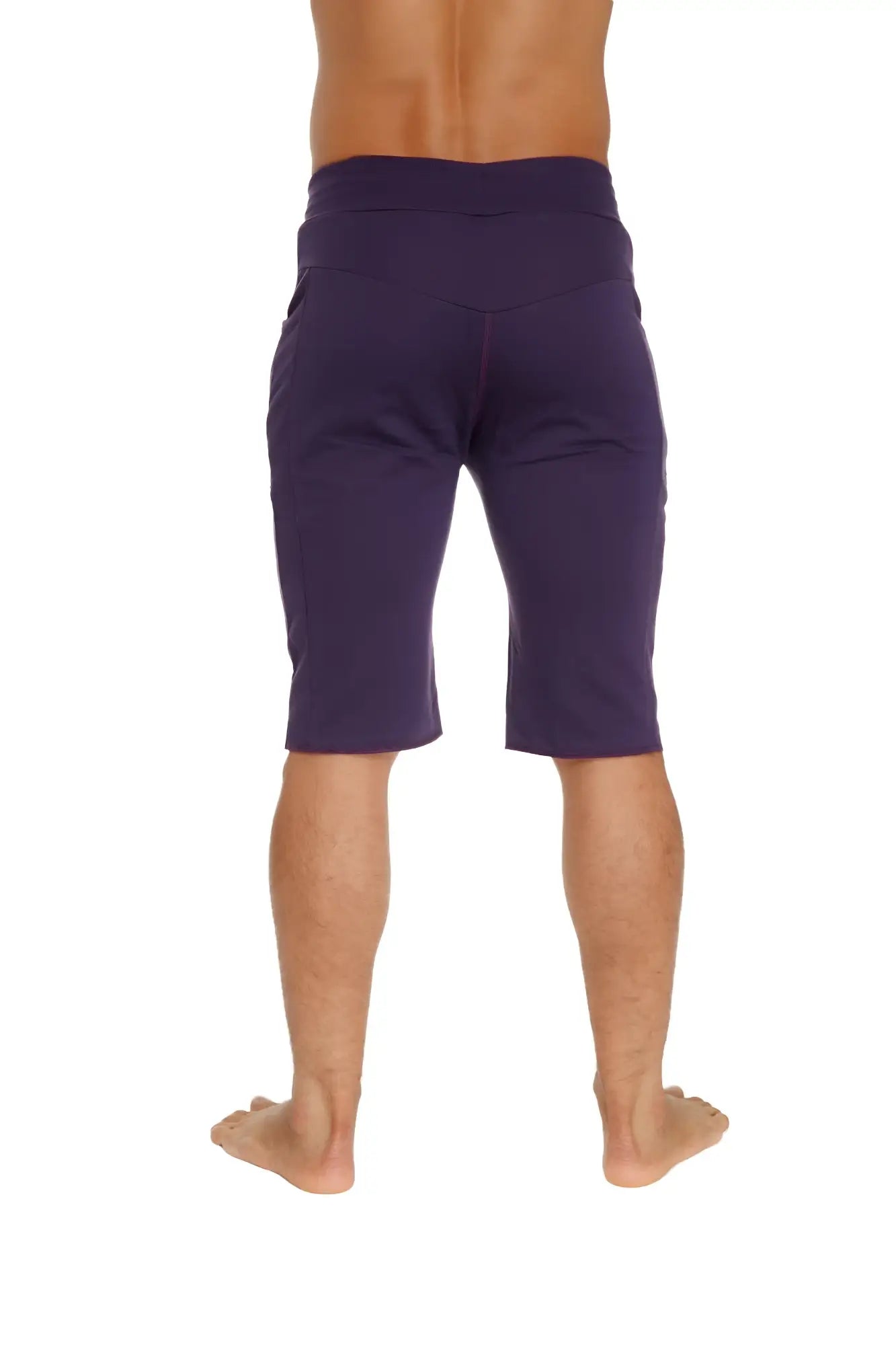 Purple eco-track shorts with elastic waistband and side pockets made from sustainable fabric for athletic use