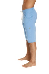 Eco-track short in ice blue with soft texture, white drawstring, and subtle side pockets for comfortable wear