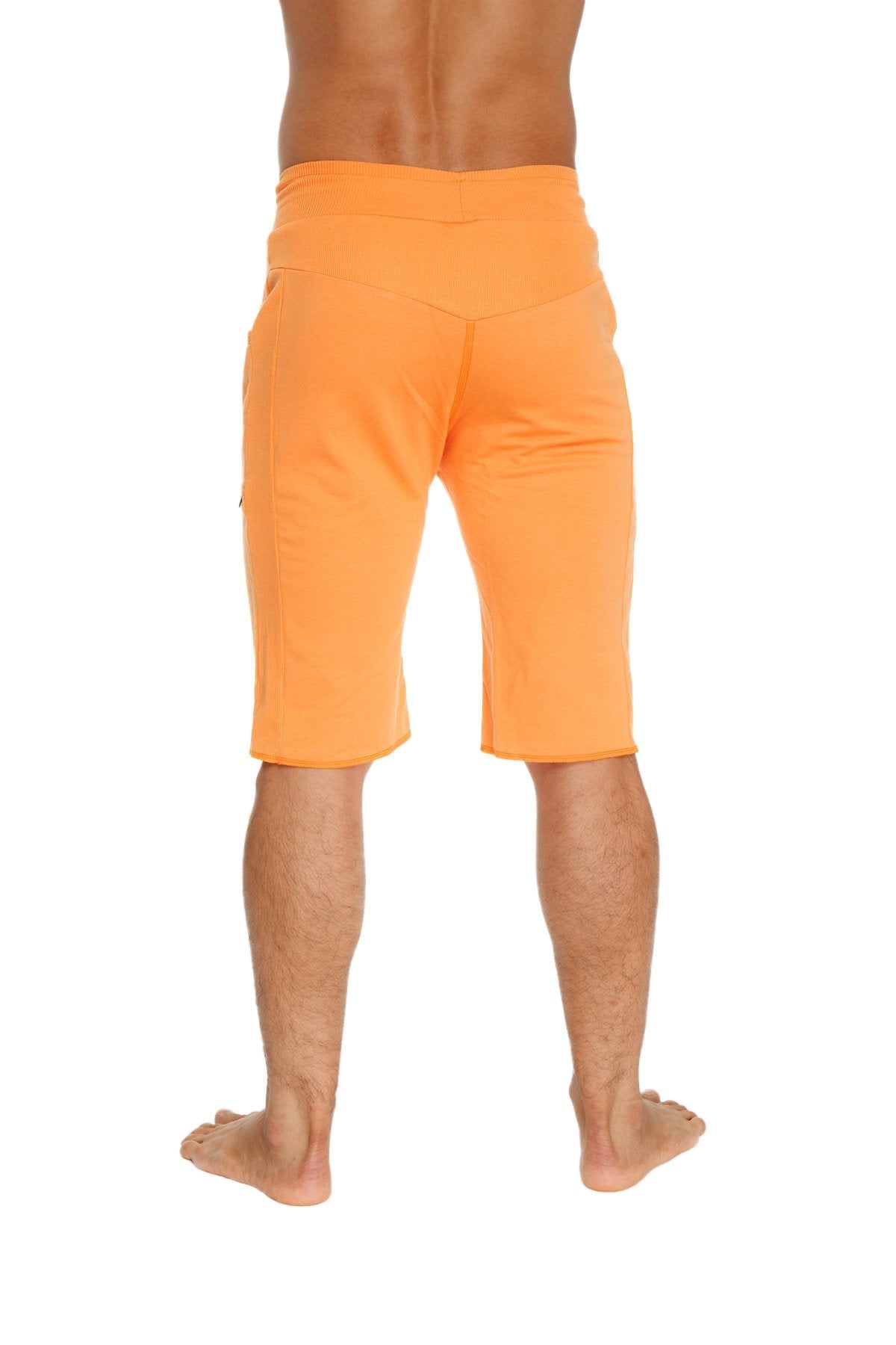 Orange eco-track athletic shorts with relaxed fit and side pockets made from eco-friendly material