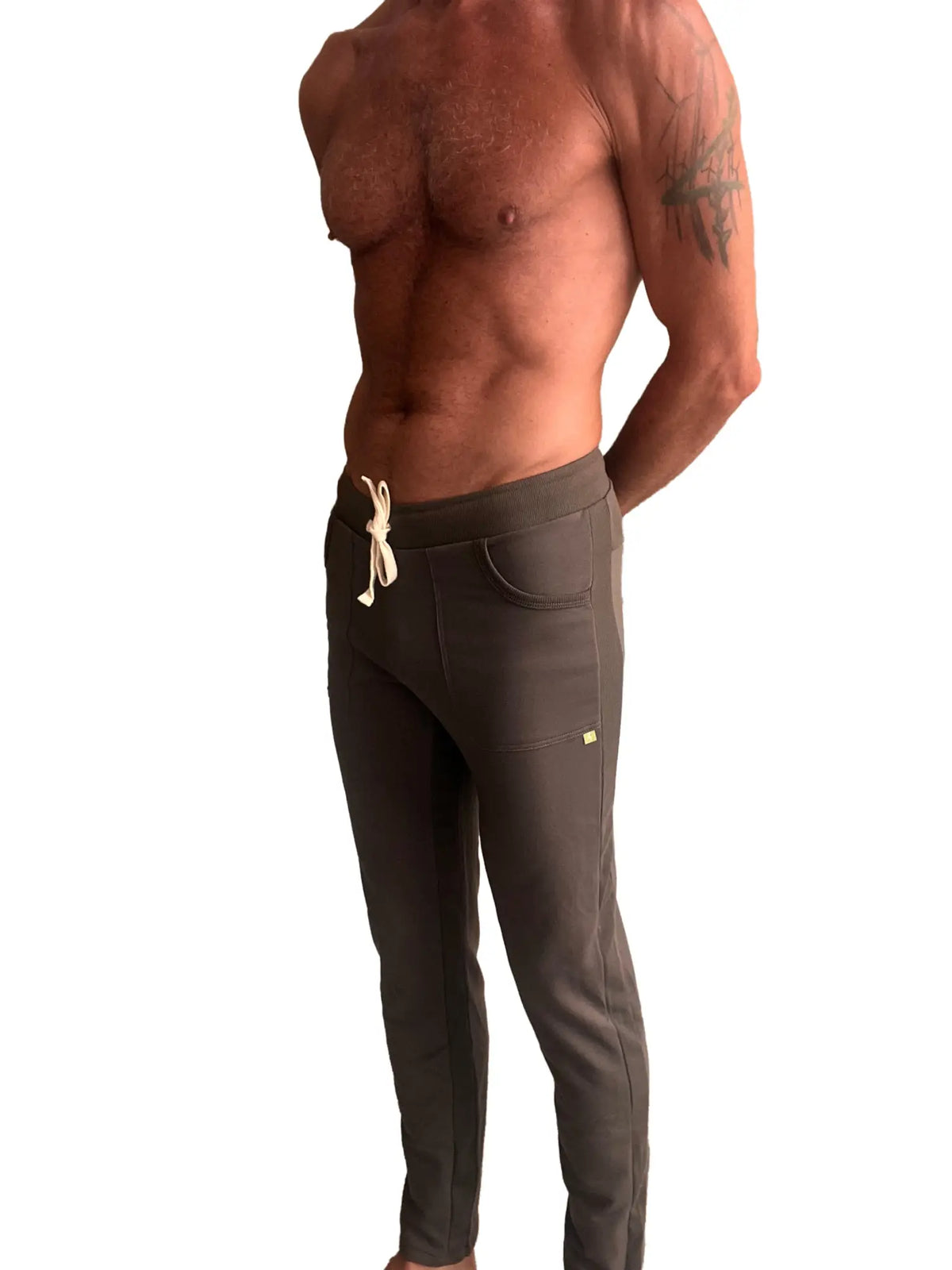 Eco-track and yoga sweat pant in dark gray with white drawstring and subtle side pockets designed for athletic use