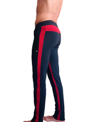 Black eco-track and yoga sweat pant featuring bold cinnabar red side stripes and matching waistband for activewear