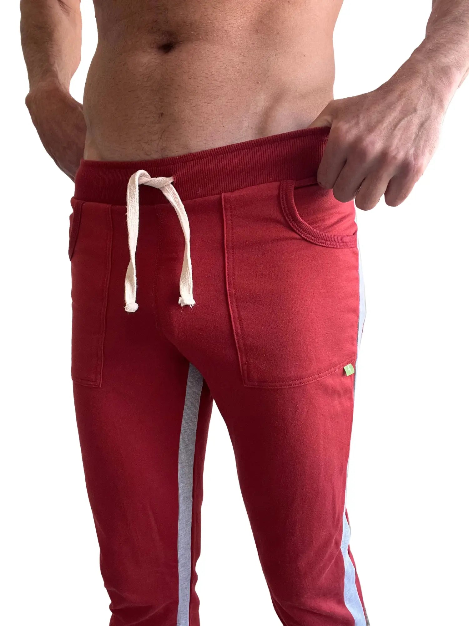 Eco-track and yoga sweat pant in cinnabar red with gray side stripes and white drawstrings for athletic wear