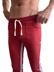 Eco-track and yoga sweat pant in cinnabar red with gray side stripes and white drawstrings for athletic wear
