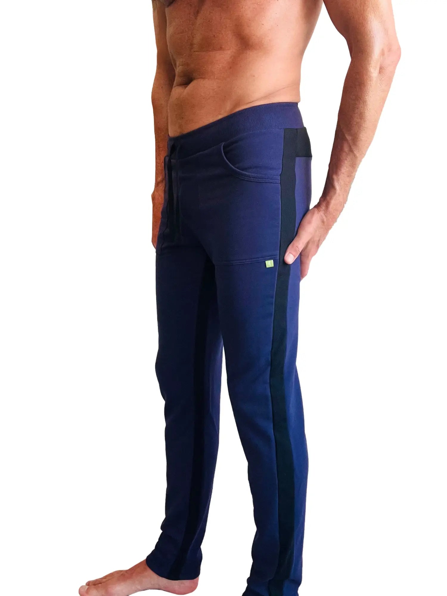 Eco-track and yoga sweat pant in navy blue with black side stripes and a small green logo on the thigh