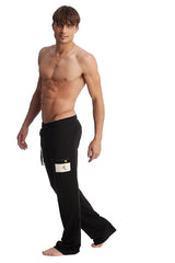 Black edge eco-track and yoga sweat pants with drawstring waist and white rectangular patch on left thigh