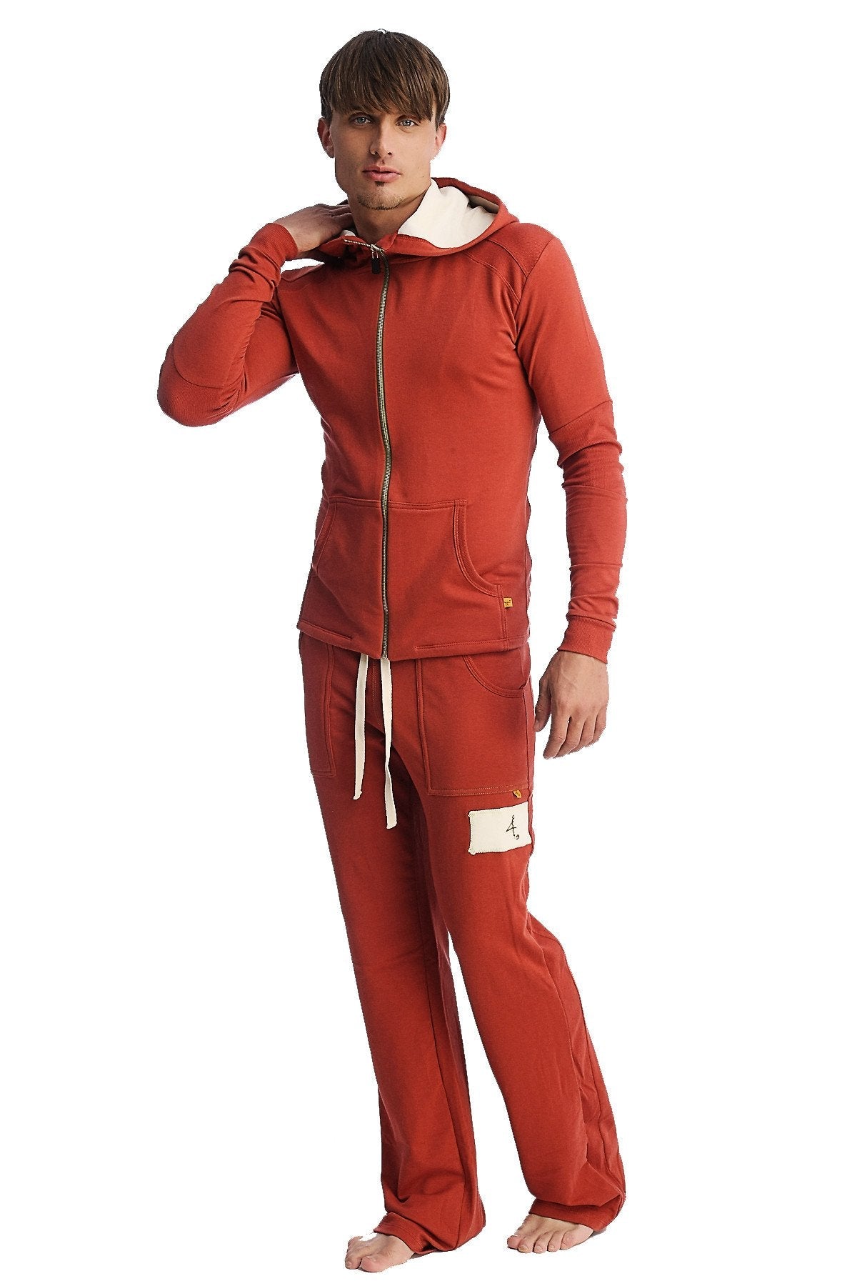 Red hooded sweatshirt with gold zipper and white drawstrings paired with cinnabar edge eco-track and yoga sweat pant