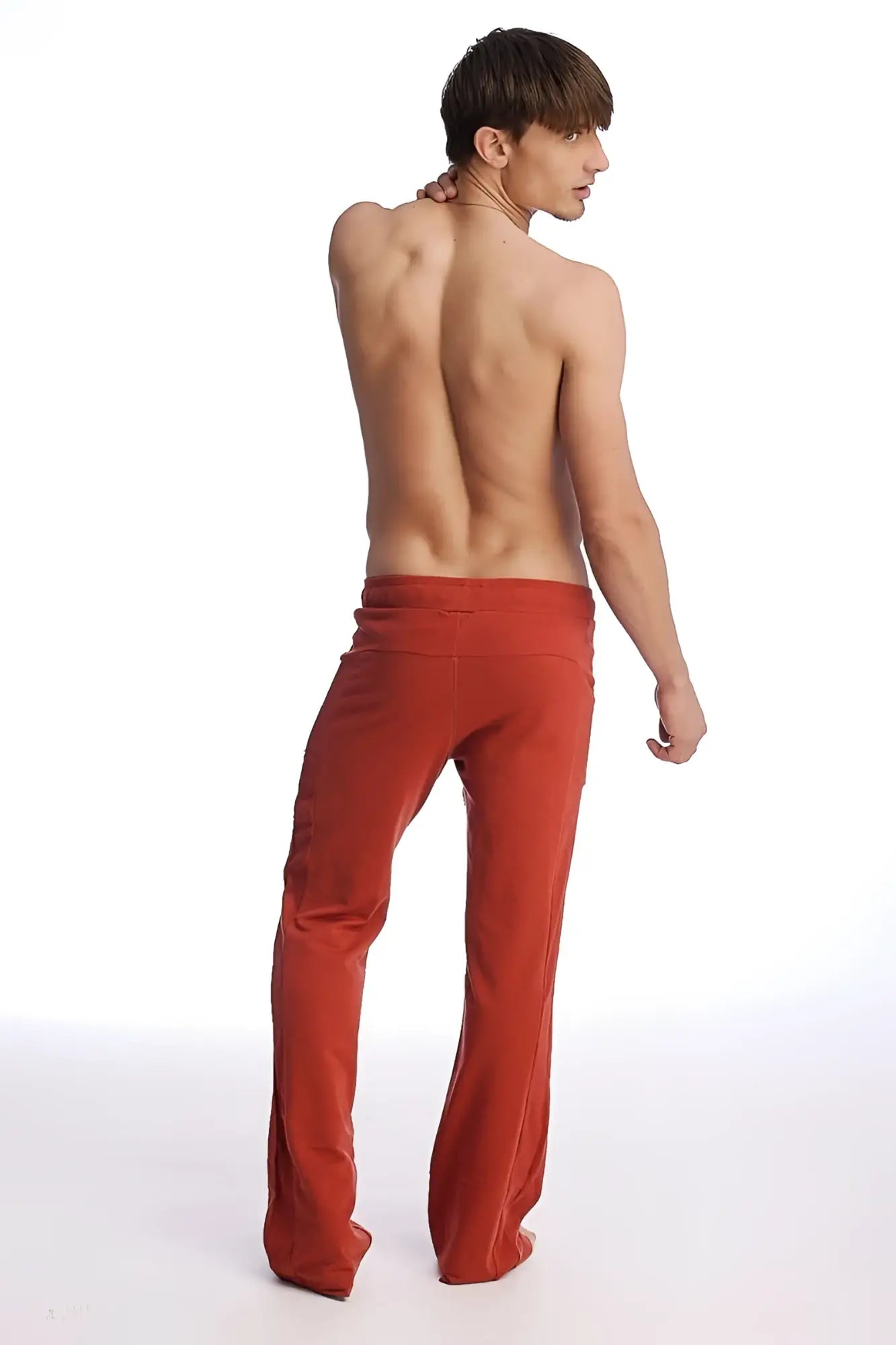 Red loose-fitting edge eco-track and yoga sweat pants with high waistband and straight-leg cut in cinnabar color