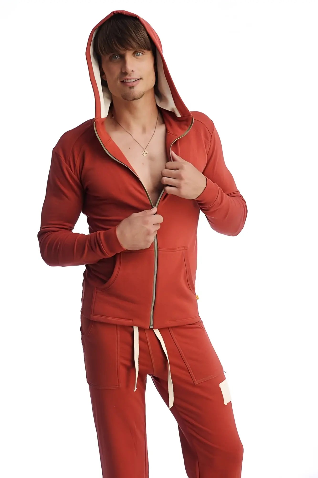 Edge form-fit crossover yoga track performance hoodie in cinnabar red with beige lining and zipper trim