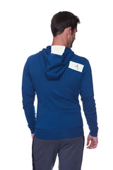 Back view of royal blue edge form-fit crossover yoga track performance hoodie with white collar and small patch