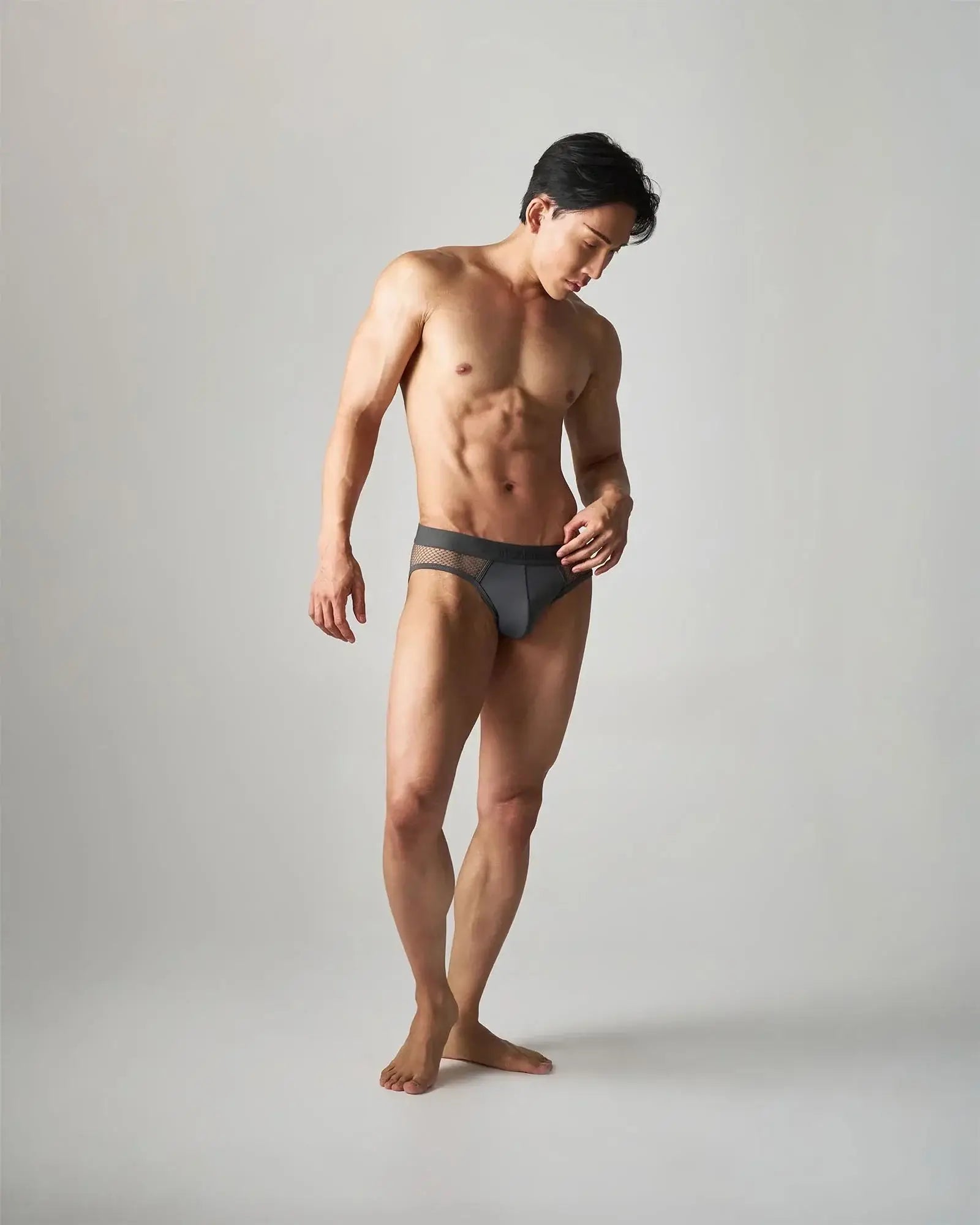 Dark gray edge net brief with breathable mesh trim made of lightweight fabric for comfortable wear