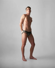 Black mesh edge net jock thong with sleek modern design featuring breathable lightweight material