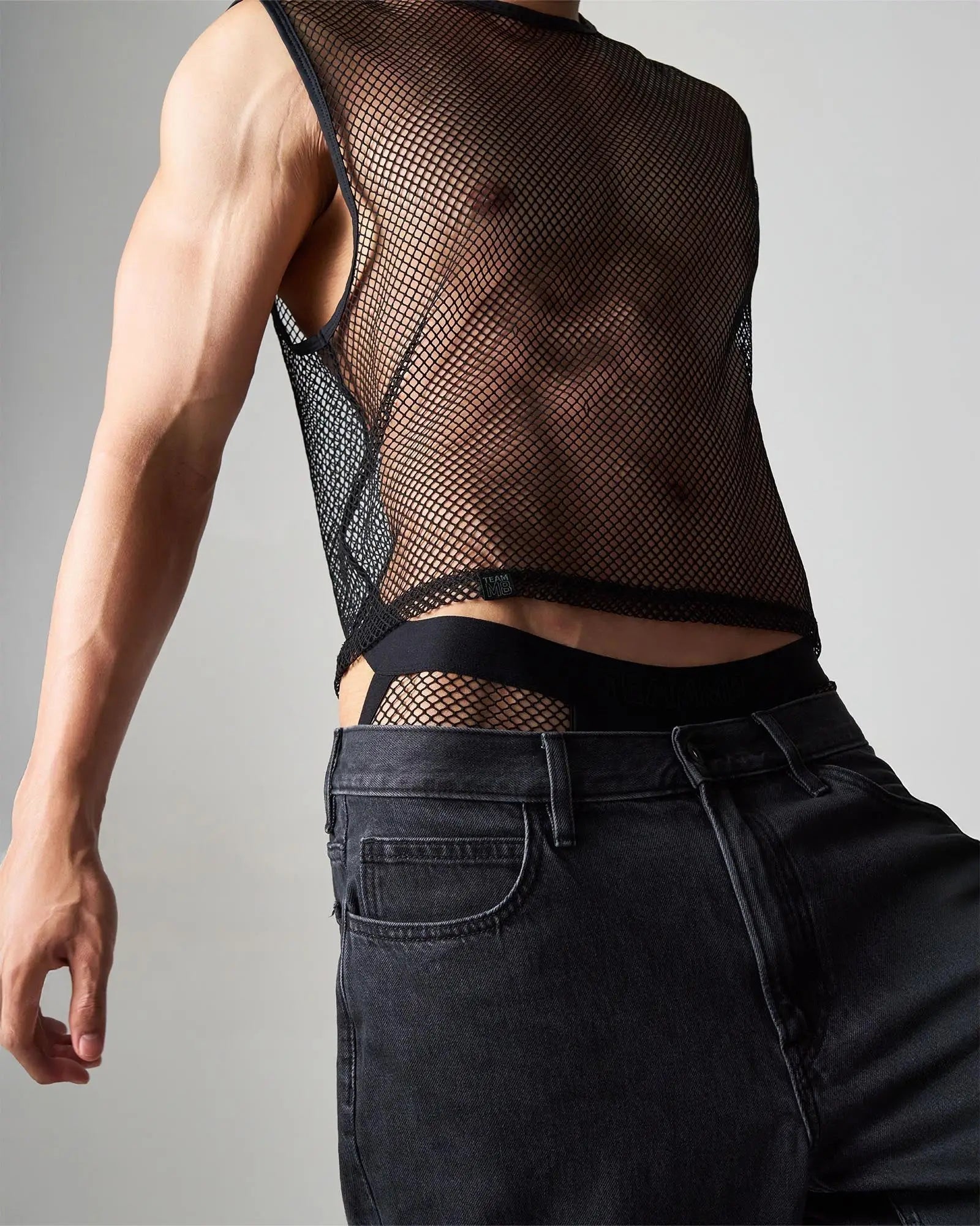 Black mesh sleeveless top edge net mesh muscle tank with fitted cropped design in breathable lightweight fabric