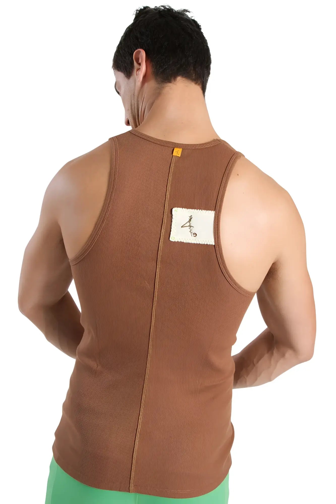 Back view of brown ribbed edge sustain tank top with white label in chocolate color made from sustainable fabric