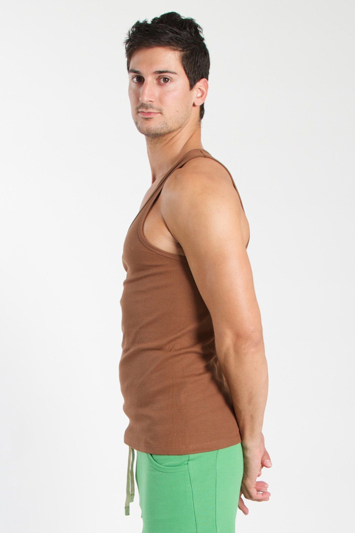 Brown sleeveless edge sustain tank top with simple fitted design in chocolate color for casual wear