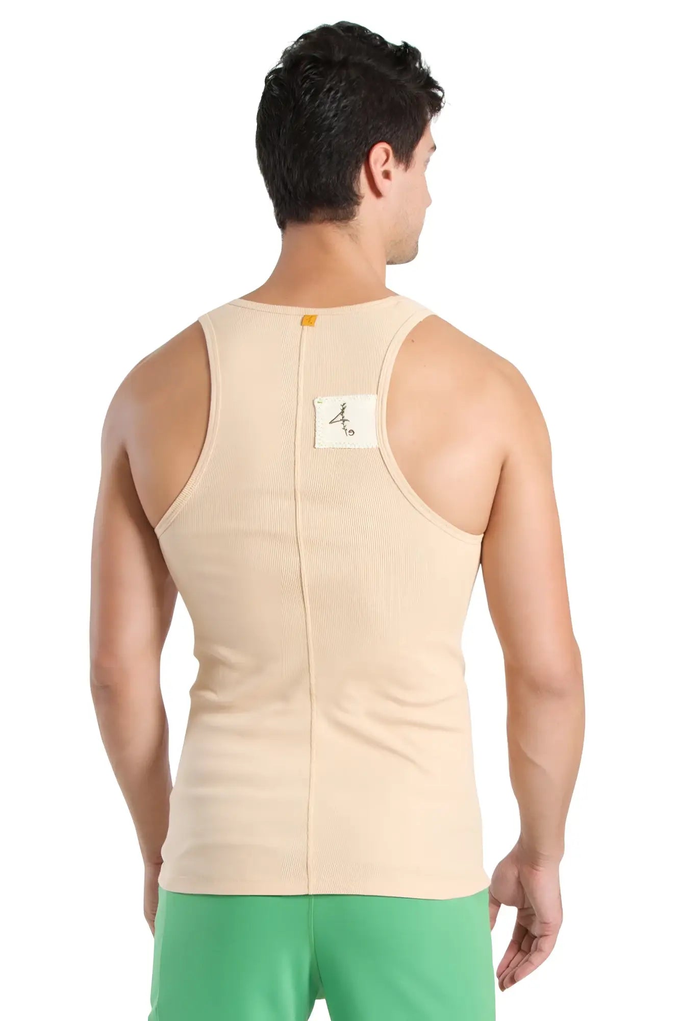 Back view of edge sustain tank top in sand beige ribbed cotton with central zipper and small white label