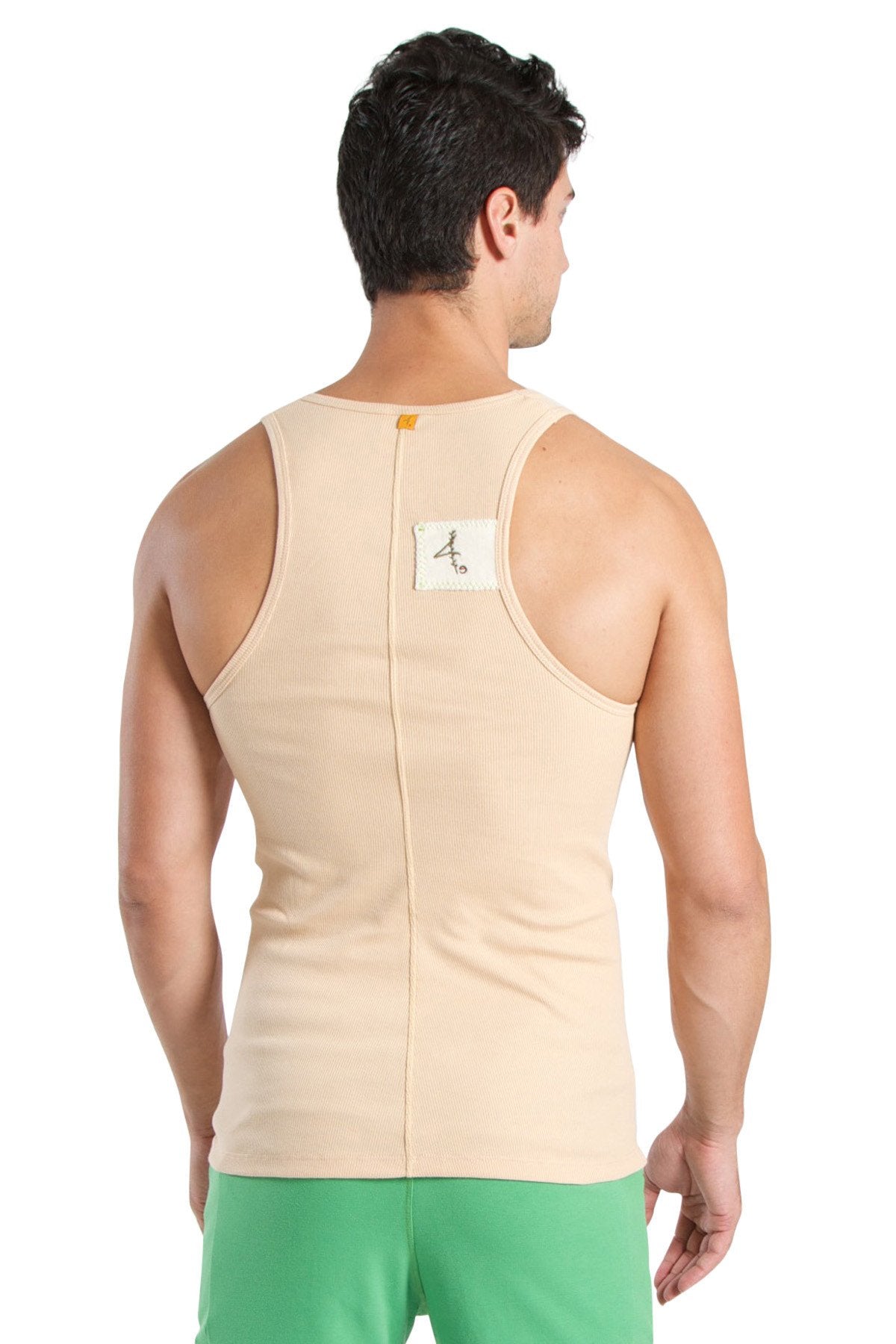 Back view of edge sustain tank top in sand beige ribbed cotton with central zipper and small white label