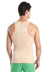 Back view of edge sustain tank top in sand beige ribbed cotton with central zipper and small white label