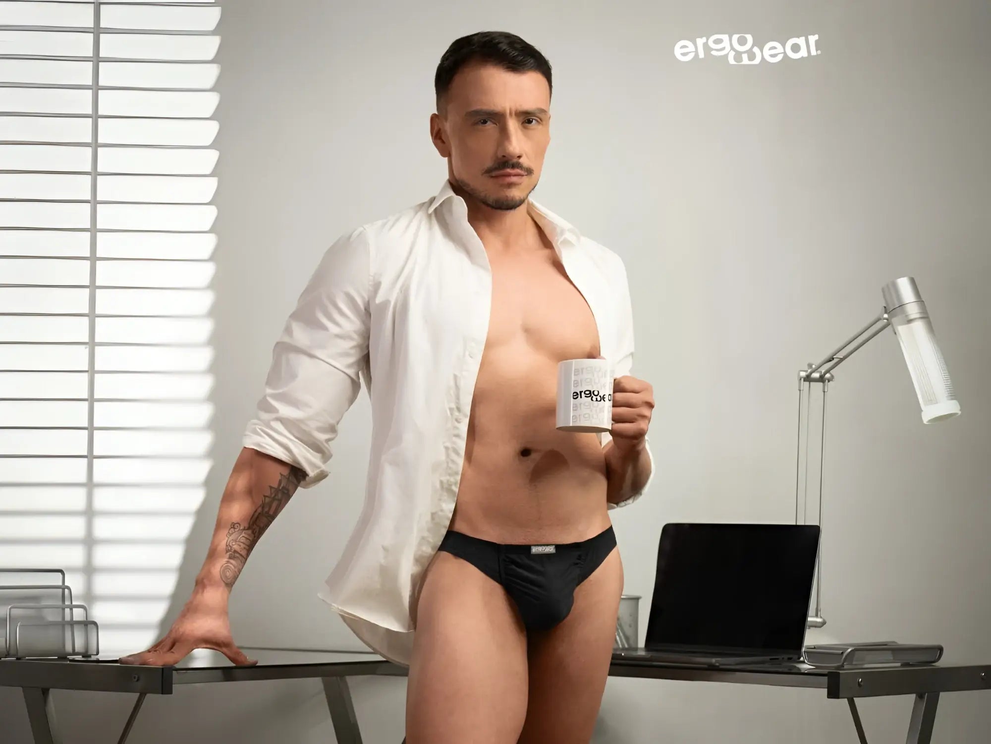 Black ergonomic cotton bikini briefs with subtle brand logo on waistband from ergowear ew1727 feel gr8 collection