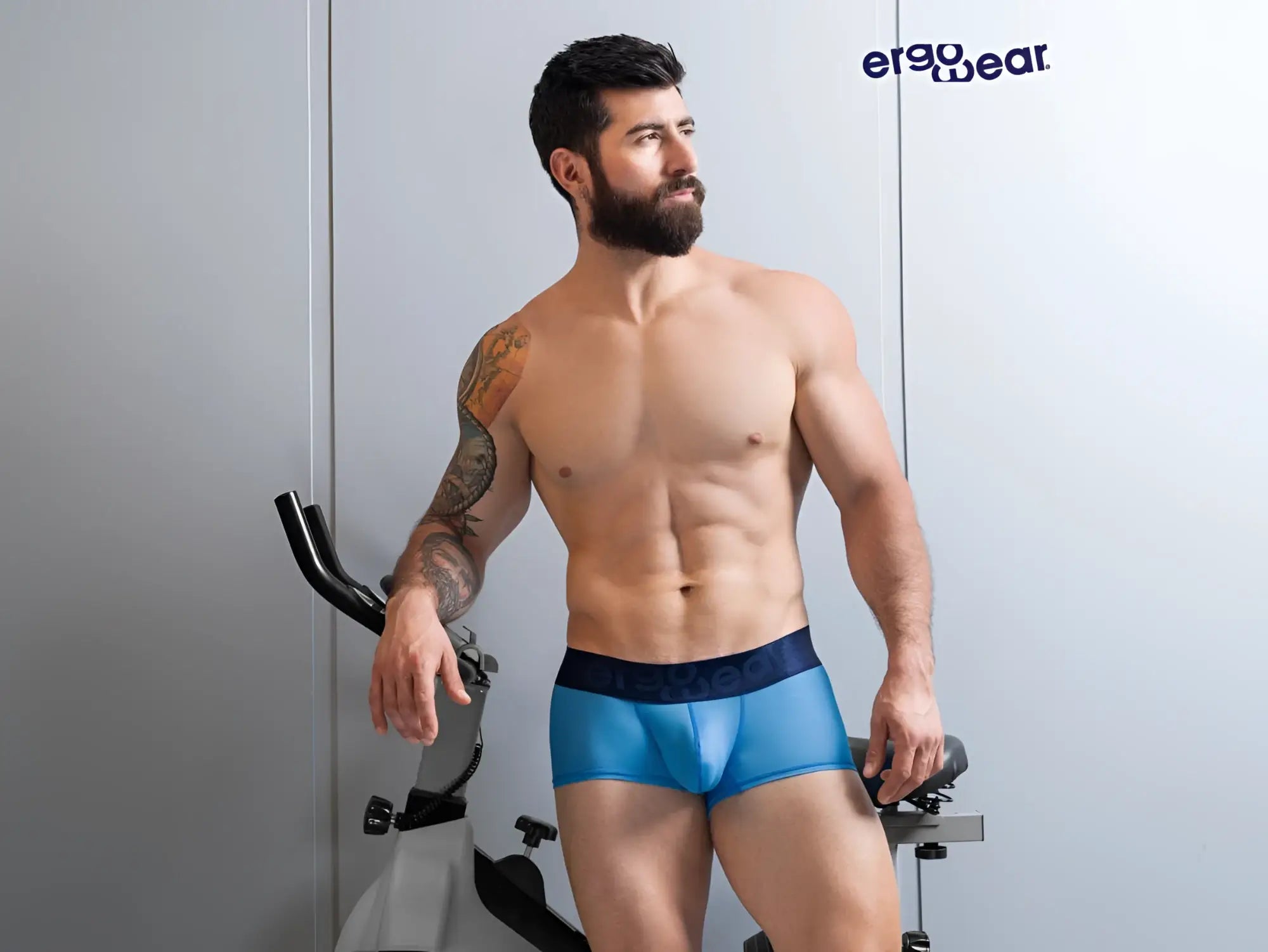 Blue athletic briefs with a dark blue waistband featuring the ergo wear logo in river blue color