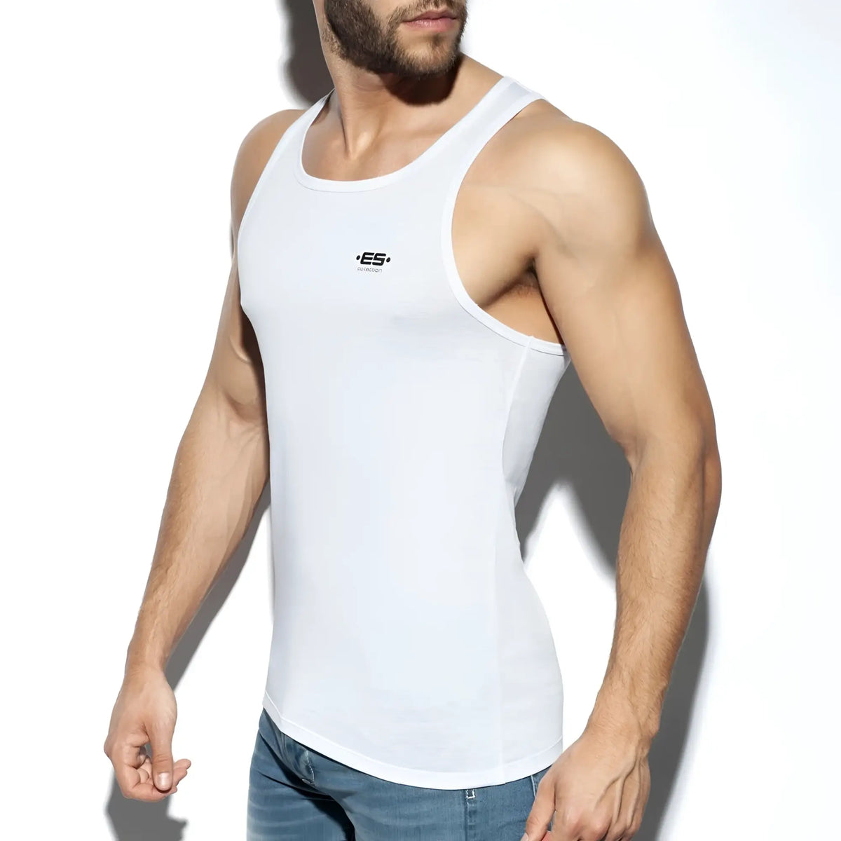 White men’s tank top es basic tank with small black logo on chest made from soft breathable fabric
