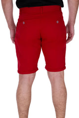 Red cotton chino shorts with rolled cuffs and small circular brand logos on the back pockets shown from the back side