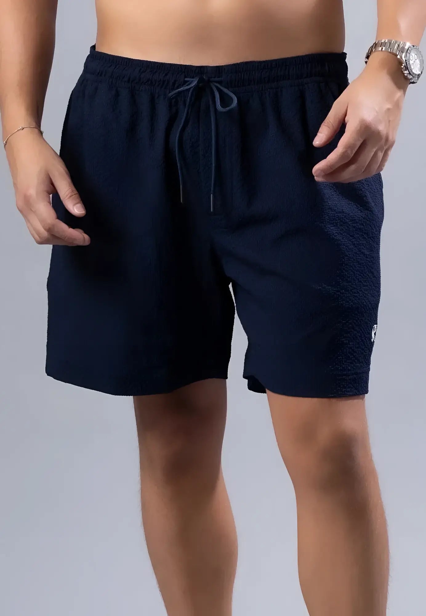 Navy blue textured essential swim short with matching drawstring waistband available in 3 colors