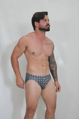 Black and white patterned briefs with repeating geometric design from the fancy symbols swim brief collection