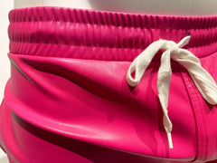 Bright pink faux leather shorts with white drawstring waistband perfect for stylish casual wear